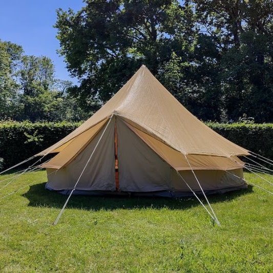 Bell tent covered by a bell tent protector