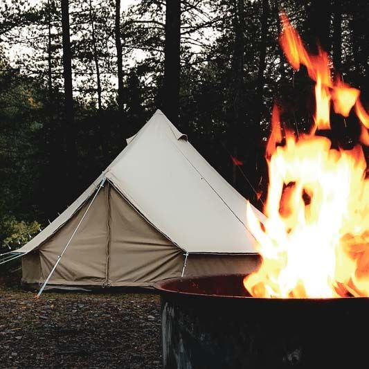 bell tent 4m Sibley 400 Pro behind a roaring fire