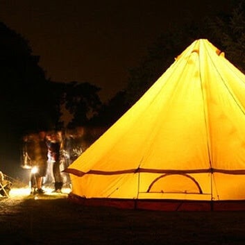 six person tent Sibley 600 Ultimate lit from inside glowing yellow at night time